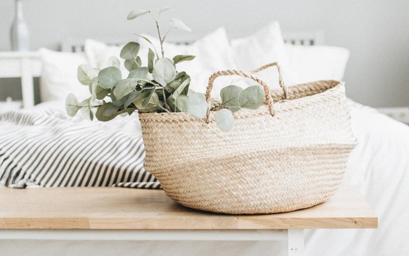 a white pillow on a white couch